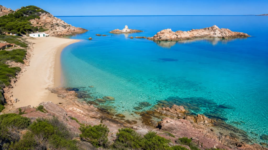 The golden-red sand of Cala Pregonda, northern Menorca
